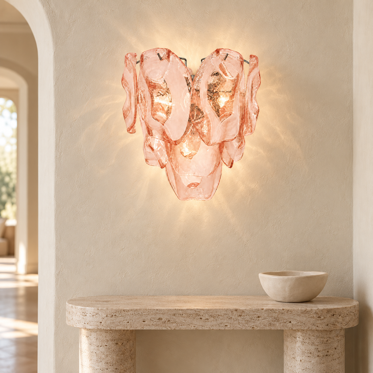 Lucent Petal pink glass wall sconce in a pale travertine entryway
