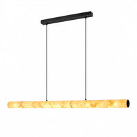 Linear pendant light with a glowing veined alabaster shade and black suspension, shown on a white background