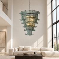 Celestine aqua-gray glass chandelier in a modern loft living room