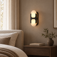 Lunara Loop wall sconce in a neutral bedroom, full fixture