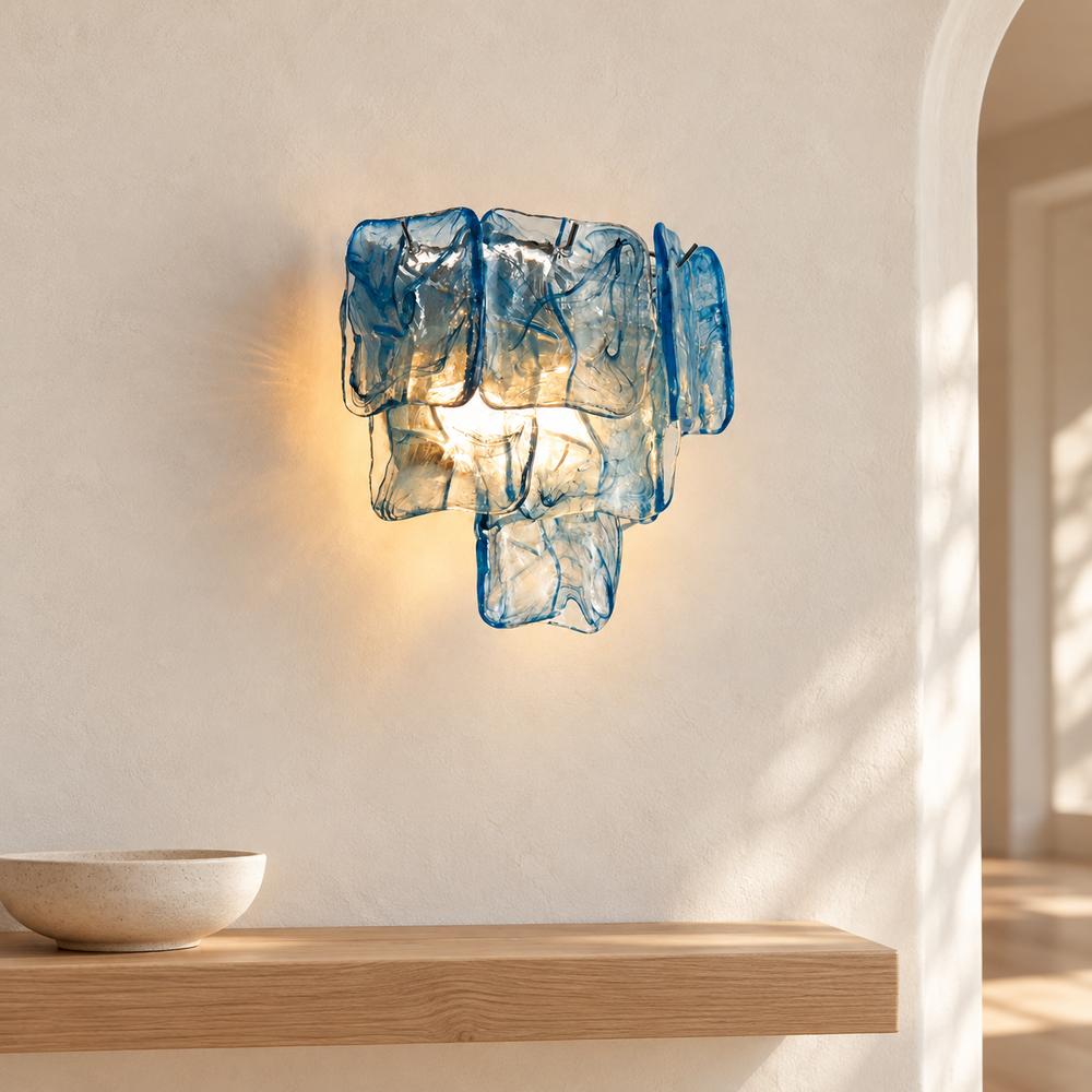 Marea Fold blue glass and silver frame wall sconce in a bright entryway scene